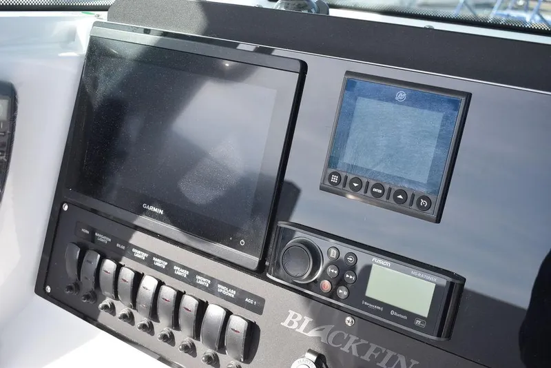 Slide: The Image of 2025 Blackfin 252CC boat dashboard with Garmin navigation and control panel. - 45