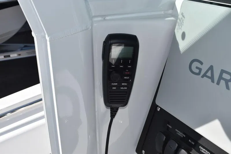 Slide: The Image of VHF radio on 2025 Blackfin 252CC boat console with Garmin panel. - 46