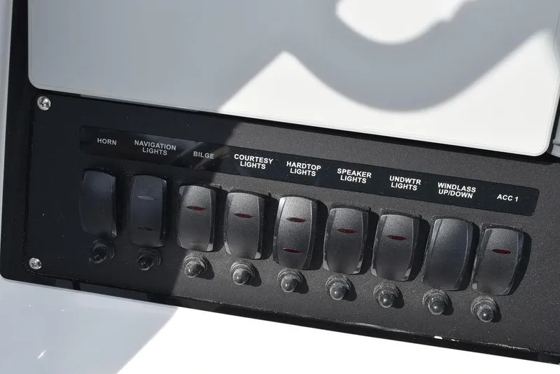 Slide: The Image of Control panel of 2025 Blackfin 252CC boat with labeled switches for various functions. - 47
