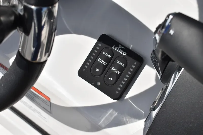 Slide: The Image of Control panel on 2025 Blackfin 252CC boat, featuring Lenco trim tab switches. - 49