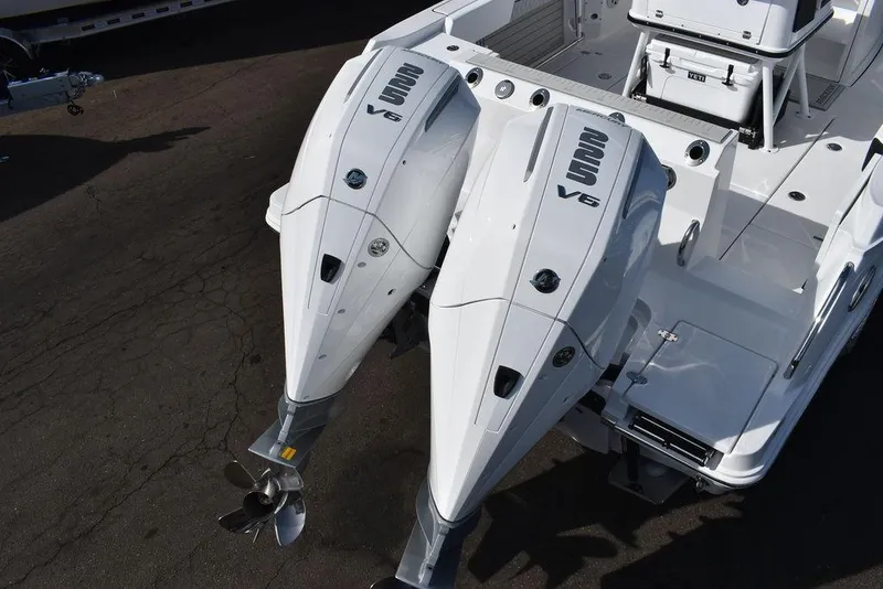 Slide: The Image of 2025 Blackfin 252CC boat with dual V6 outboard engines, viewed from above. - 7