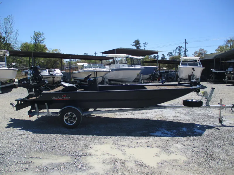 Slide: The Image of 2025 Gator Tail 1860 Extreme CC boat on trailer in outdoor lot. - 0