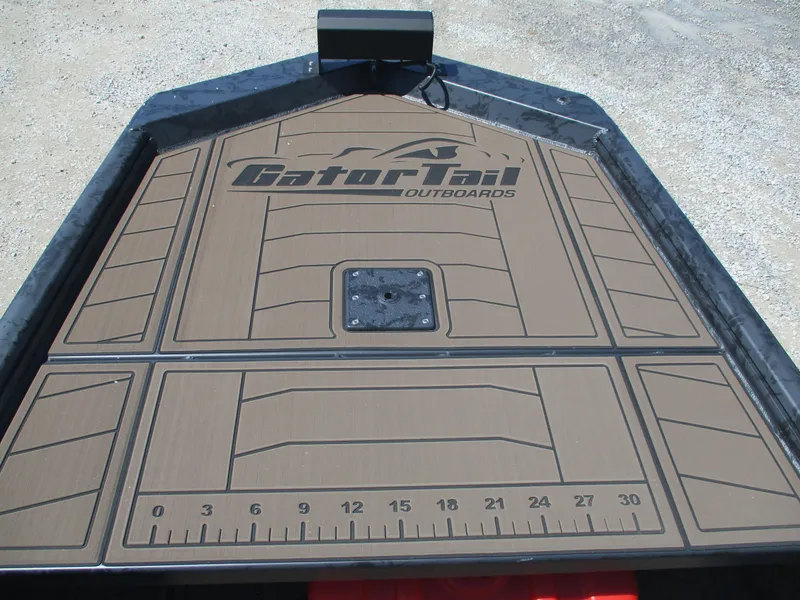 Slide: The Image of 2025 Gator Tail 1860 Extreme CC boat deck with logo and measurement markings. - 2