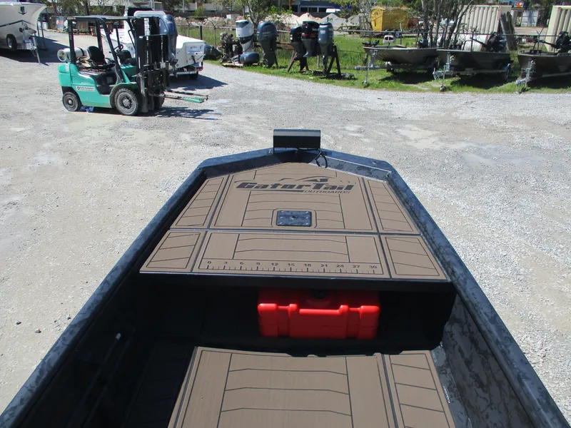 Slide: The Image of 2025 Gator Tail 1860 Extreme CC boat with deck view, parked outdoors. - 3