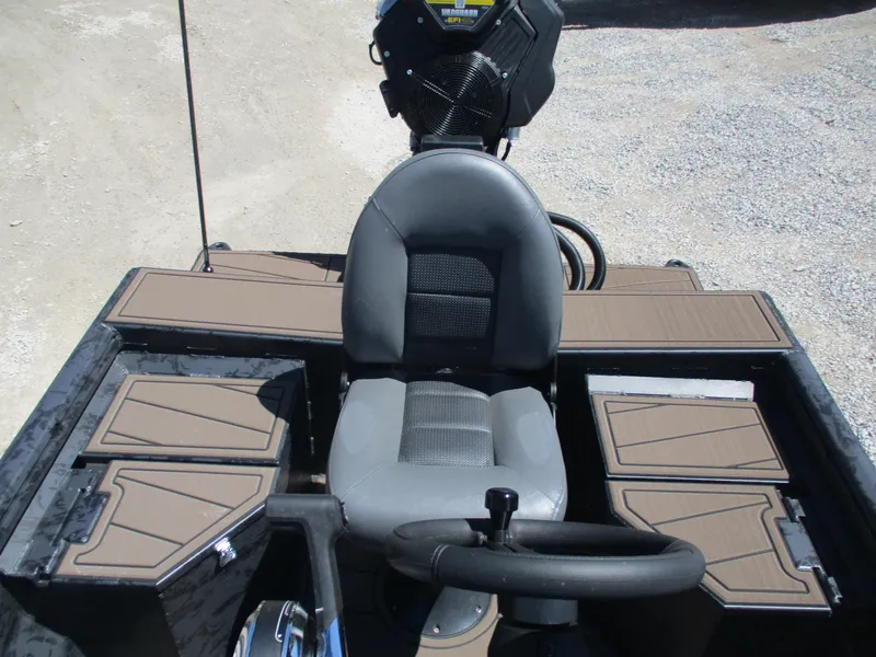 Slide: The Image of 2025 Gator Tail 1860 Extreme CC boat interior with steering wheel and seating. - 4