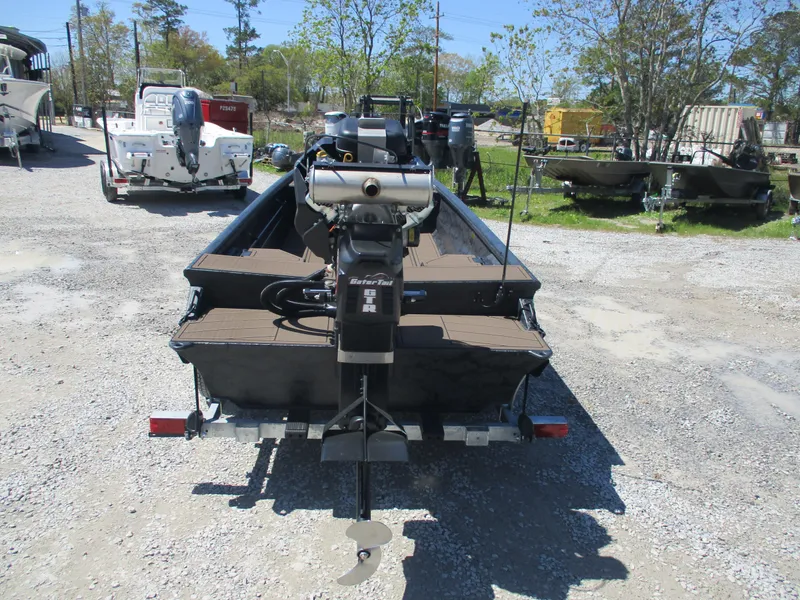 Slide: The Image of 2025 Gator Tail 1860 Extreme CC boat on a trailer in a gravel lot. - 8