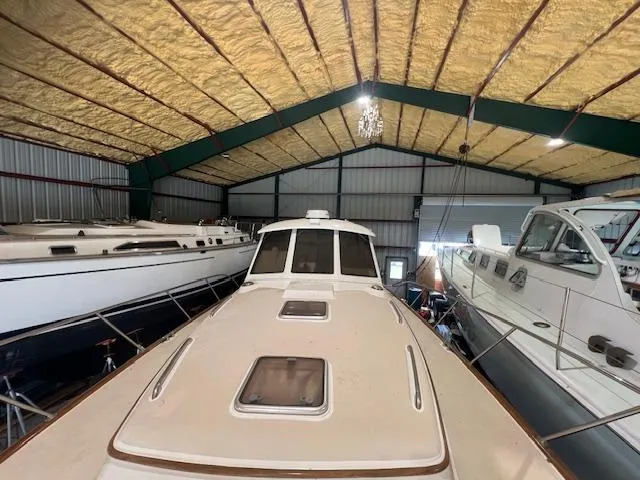 Slide: The Image of 2001 Little Harbor WhisperJet 44 yacht stored in a spacious indoor facility. - 11