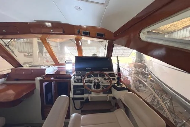 Slide: The Image of Interior view of 2001 Little Harbor WhisperJet 44 helm with wooden accents and modern controls. - 14