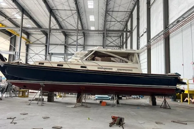 Slide: The Image of 2001 Little Harbor WhisperJet 44 yacht in a spacious indoor facility. - 23