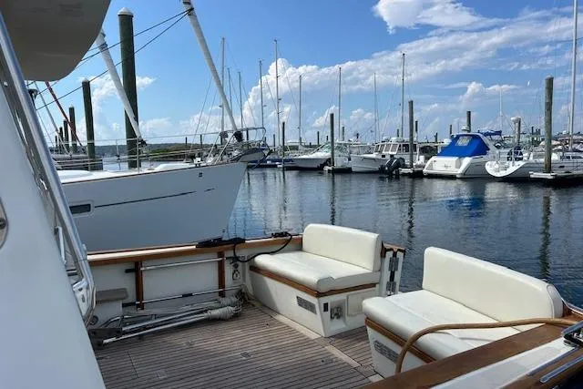 Slide: The Image of 2001 Little Harbor WhisperJet 44 yacht docked at marina with clear skies. - 3