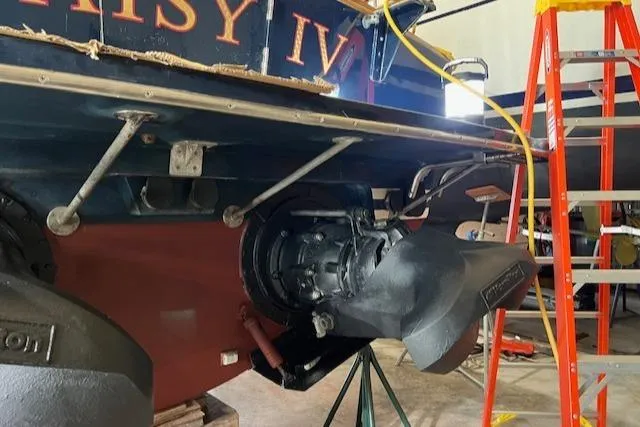 Slide: The Image of 2001 Little Harbor WhisperJet 44 in maintenance, showcasing jet drive and hull details. - 34