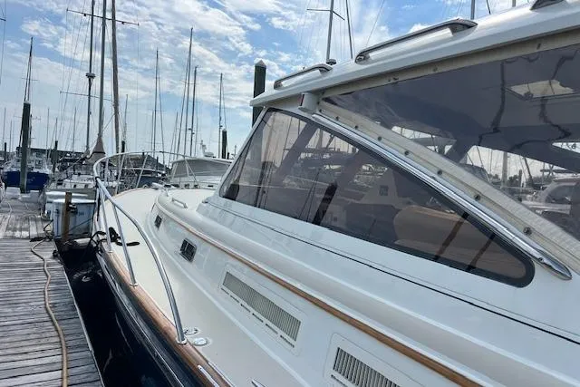 Slide: The Image of 2001 Little Harbor WhisperJet 44 docked at marina, showcasing sleek design and elegant lines. - 35