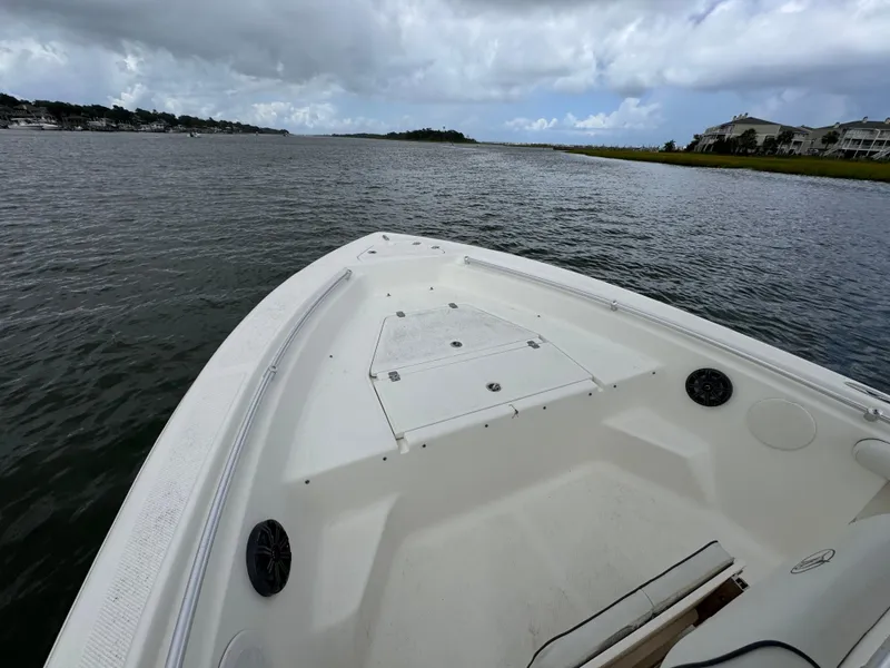 Slide: The Image of 2008 Key West 211 Bluewater boat on calm waters under cloudy skies. - 8