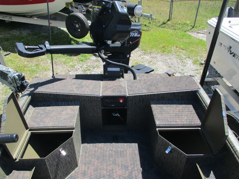 Slide: The Image of 2025 Gator Tail 1750 Savage boat interior with storage compartments and motor. - 7