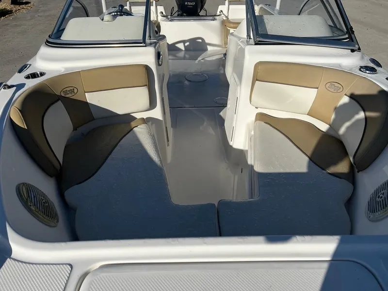 Slide: The Image of 2018 Key West 186 DC boat interior with beige and white seating. - 10