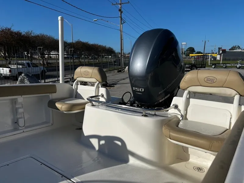 Slide: The Image of 2018 Key West 186 DC boat interior with seating and 150 HP outboard motor. - 12