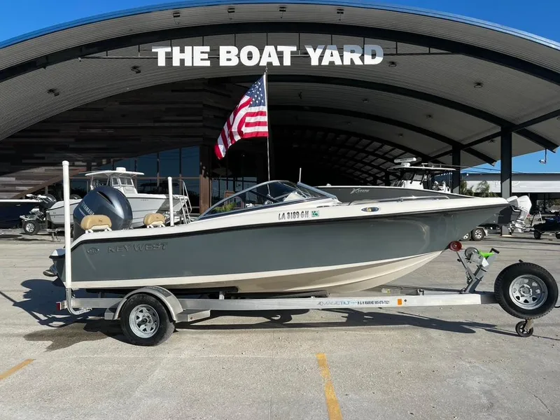 Slide: The Image of 2018 Key West 186 DC boat on trailer at The Boat Yard with American flag. - 2