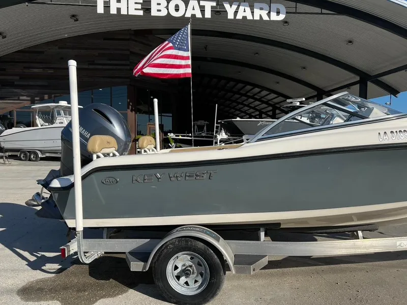 Slide: The Image of 2018 Key West 186 DC boat on trailer at The Boat Yard, American flag visible. - 3