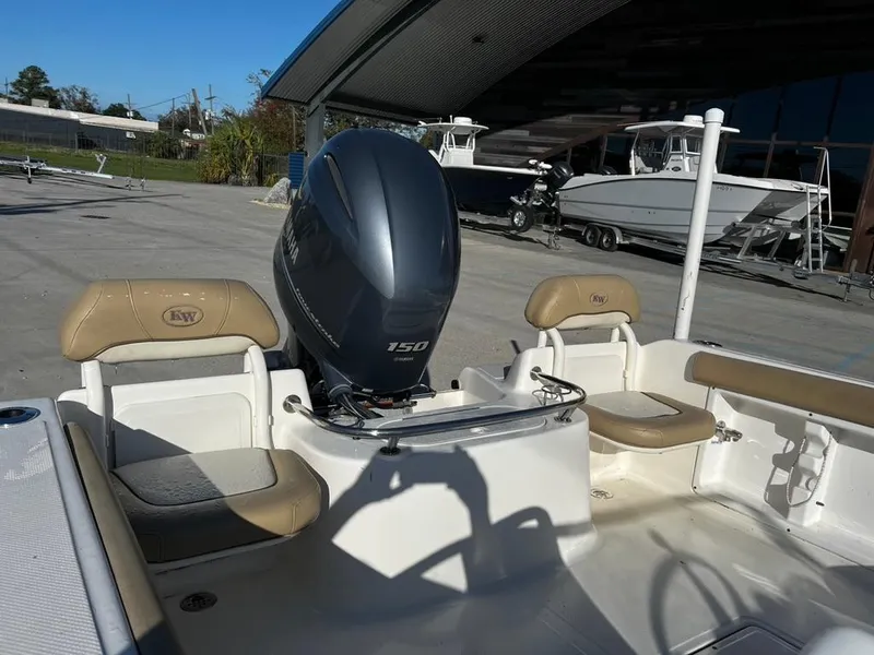 Slide: The Image of 2018 Key West 186 DC boat with Yamaha 150 engine, docked outdoors. - 8