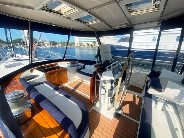 Slide: The Image of Luxurious 1989 Irwin 54 yacht cockpit with elegant seating and steering wheel. - 18