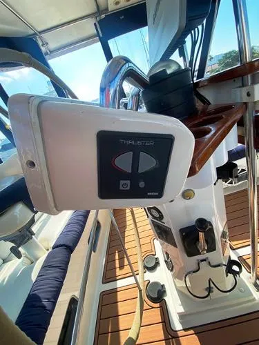 Slide: The Image of Control panel on 1989 Irwin 54 sailboat, featuring thruster controls and teak deck. - 25