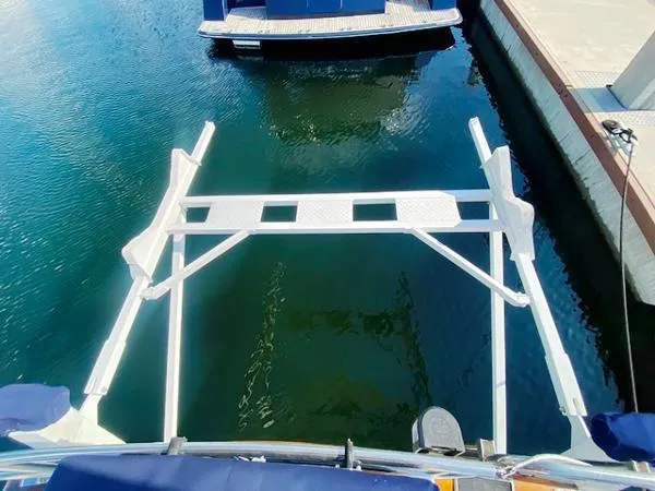 Slide: The Image of Sailboat stern view with swim platform, Irwin 54, 1989 model, docked in marina. - 29