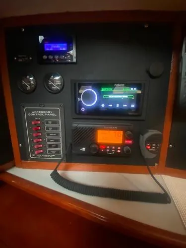 Slide: The Image of Control panel of a 1989 Irwin 54 yacht with navigation and communication equipment. - 38