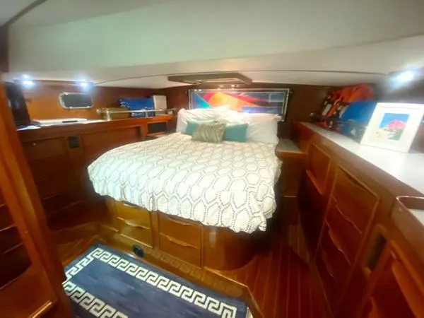 Slide: The Image of Luxurious cabin interior of 1989 Irwin 54 yacht with cozy bed and wooden furnishings. - 47