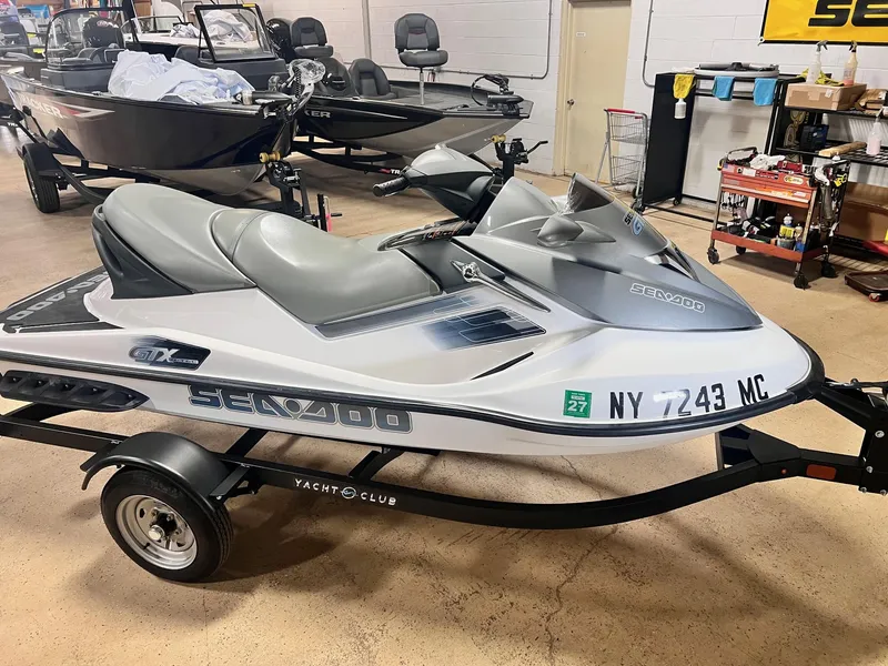 Slide: The Image of 2006 Sea-Doo GTX 155HP jet ski on trailer in showroom setting. - 4