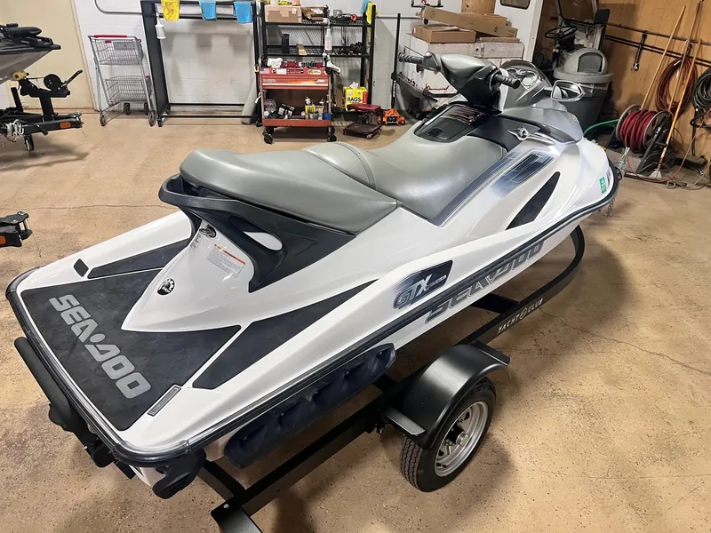Slide: The Image of 2006 Sea-Doo GTX 155HP jet ski on trailer in a garage setting. - 5
