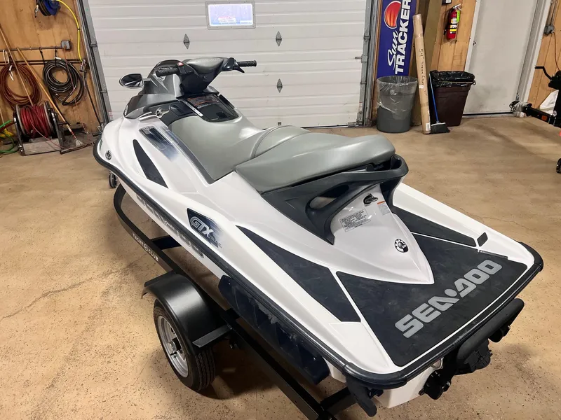 Slide: The Image of 2006 Sea-Doo GTX 155HP jet ski on trailer in garage setting. - 6