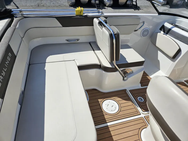Slide: The Image of 2019 Bayliner VF5 boat interior with white seating and wood-patterned flooring. - 10