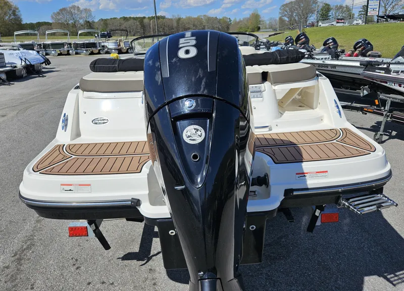 Slide: The Image of 2019 Bayliner VF5 boat with powerful outboard motor, docked in a marina. - 14