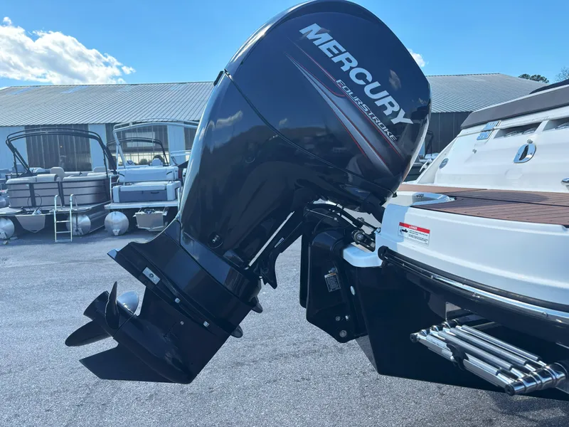 Slide: The Image of 2019 Bayliner VF5 boat with Mercury FourStroke outboard motor, docked outdoors. - 16