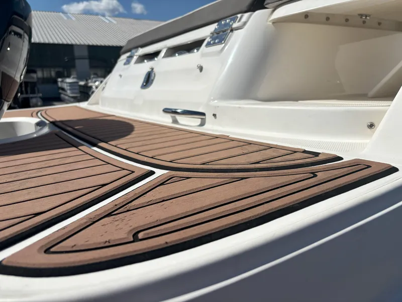 Slide: The Image of 2019 Bayliner VF5 boat deck with wood finish, showcasing sleek design and modern features. - 6