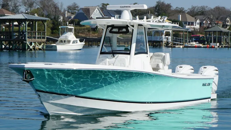 Slide: The Image of 2023 Regulator 34 boat on calm water, featuring a sleek design and modern equipment. - 3