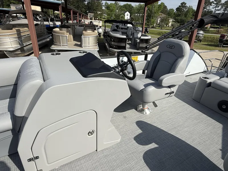 Slide: The Image of 2025 Bentley Pontoons Legacy Swingback 240 interior with steering console and seating. - 16