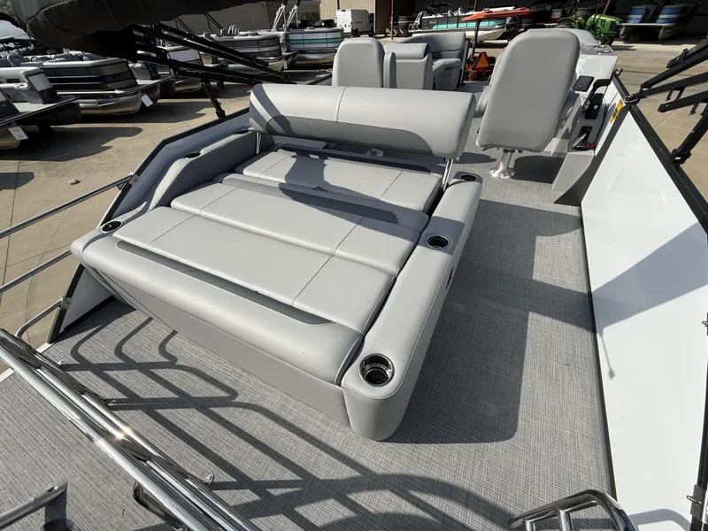 Slide: The Image of 2025 Bentley Pontoons Legacy Swingback 240 with luxurious seating and modern design. - 5