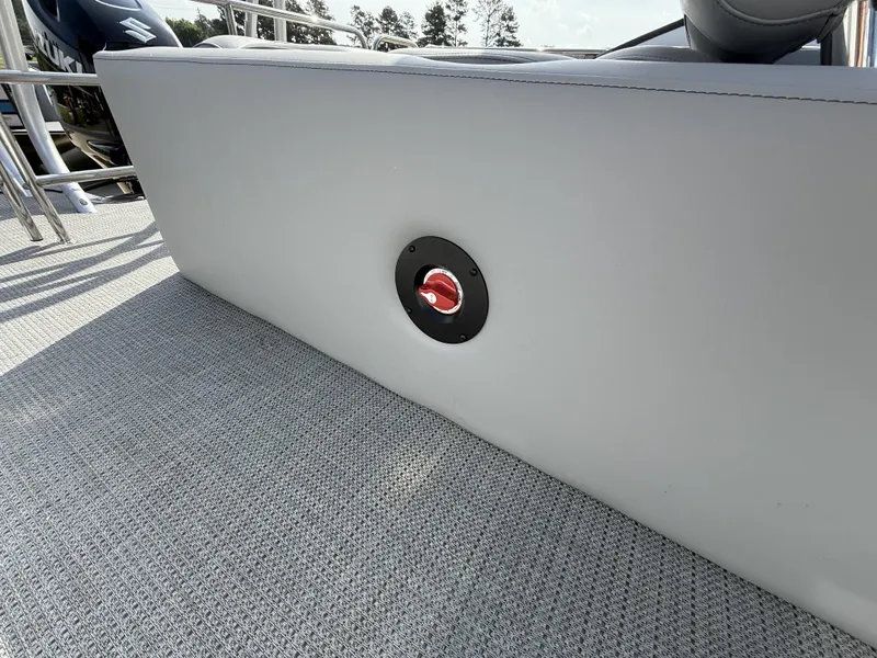 Slide: The Image of 2025 Bentley Pontoons Legacy Swingback 240 interior detail with gray upholstery and red accent. - 7