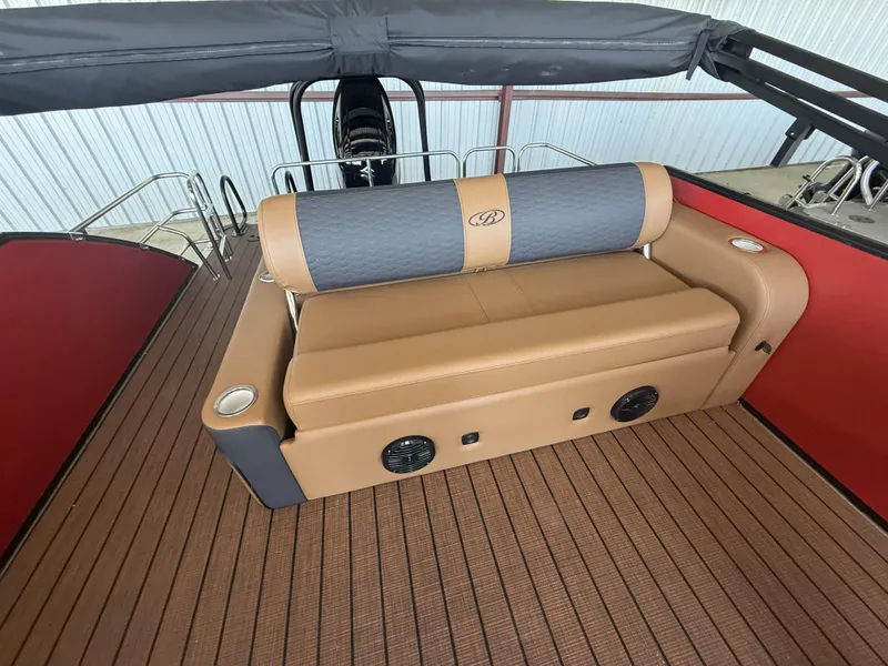 Slide: The Image of 2025 Bentley Pontoons Elite 253 Swingback interior with tan and gray seating. - 12