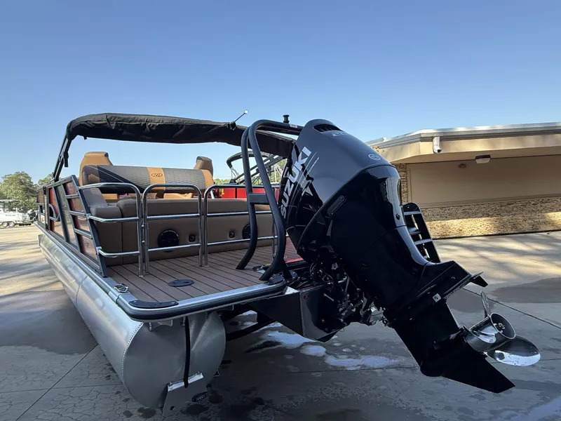 Slide: The Image of 2025 Bentley Pontoons Elite 253 Swingback with Suzuki outboard motor, docked on a sunny day. - 7