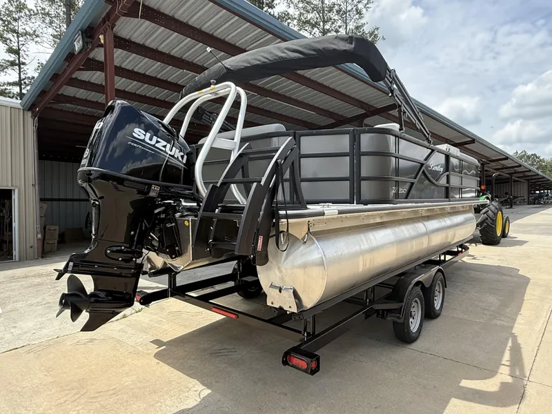 Slide: The Image of 2025 Bentley Pontoons Legacy Cruise XL 220 with Suzuki engine on trailer. - 6