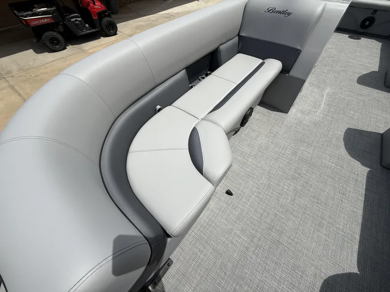 Slide: The Image of 2025 Bentley Pontoons Legacy Cruise XL 220 interior with luxurious seating and modern design. - 9