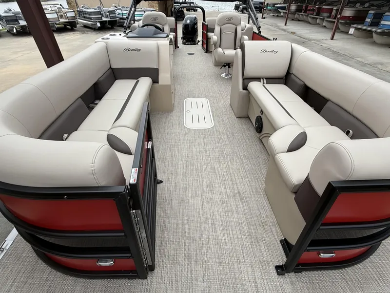 Slide: The Image of 2025 Bentley Pontoons Legacy Navigator 243 with luxurious seating and modern design. - 3
