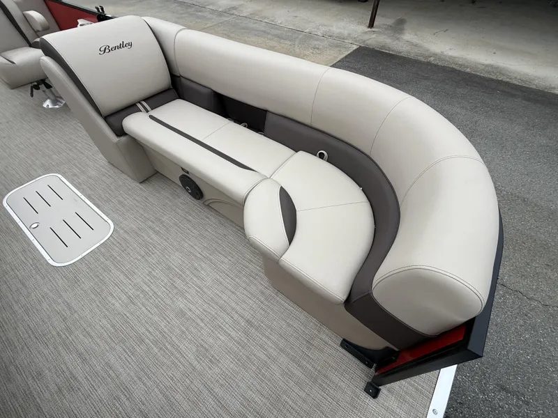 Slide: The Image of Luxurious seating on 2025 Bentley Pontoons Legacy Navigator 243, featuring elegant beige upholstery. - 4
