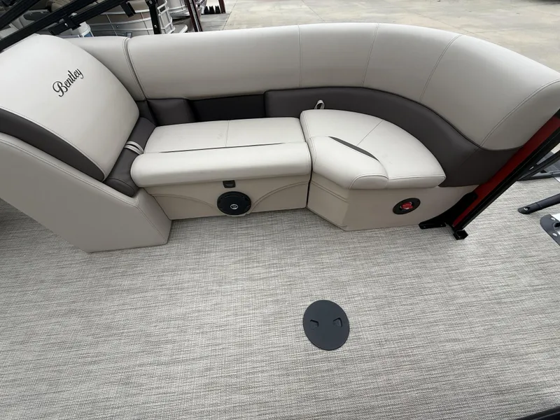 Slide: The Image of 2025 Bentley Pontoons Legacy Navigator 243 interior seating, featuring luxurious beige upholstery. - 6