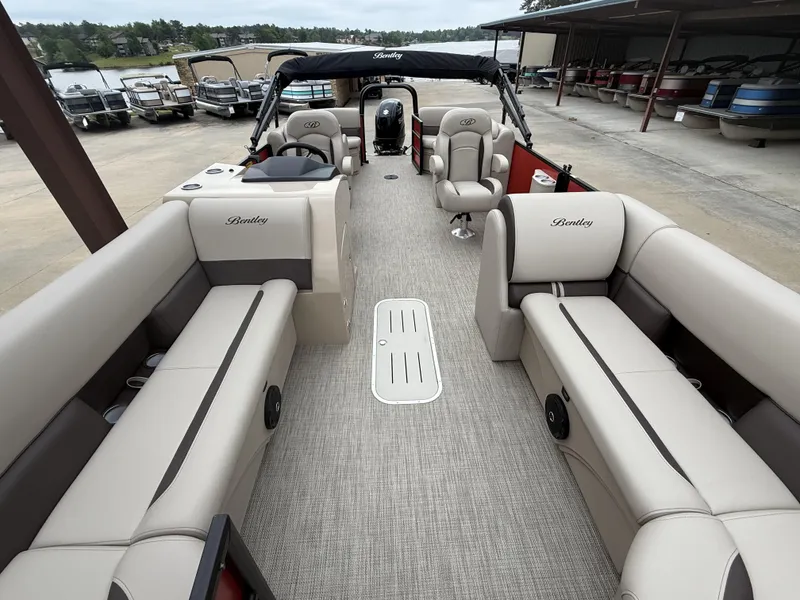 Slide: The Image of 2025 Bentley Pontoons Legacy Navigator 243 interior with luxurious seating and spacious layout. - 9