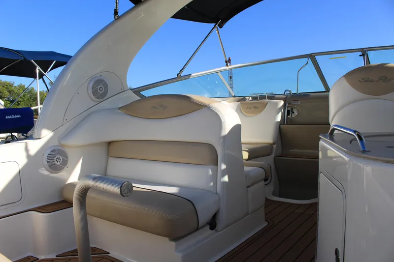 Slide: The Image of 2008 Sea Ray Sundancer boat interior with beige seating and wood flooring. - 16