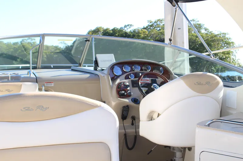 Slide: The Image of 2008 Sea Ray Sundancer boat interior with steering wheel and dashboard controls. - 4