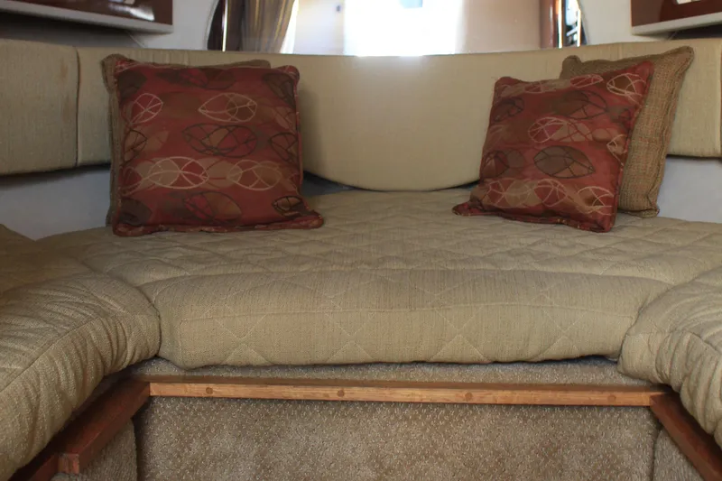 Slide: The Image of Interior cabin of 2008 Sea Ray Sundancer with beige cushions and decorative pillows. - 6